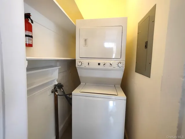 a kitchen with stainless steel appliances granite countertop a refrigerator a stove and a sink