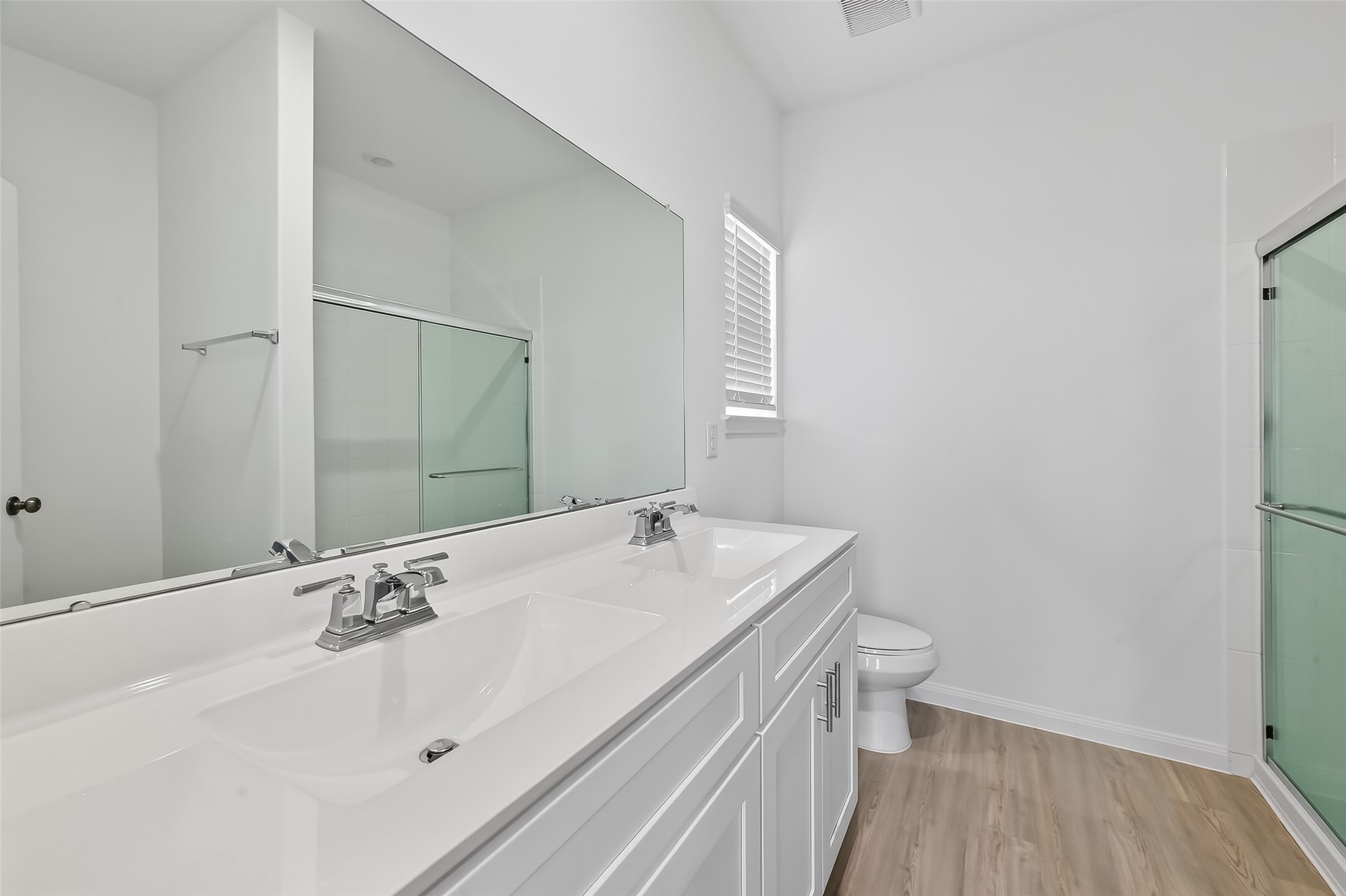 17902 Slurry Rake Lane Hockley, TX 77447 - Photo 11 of 32 a bathroom with a sink and a large mirror
