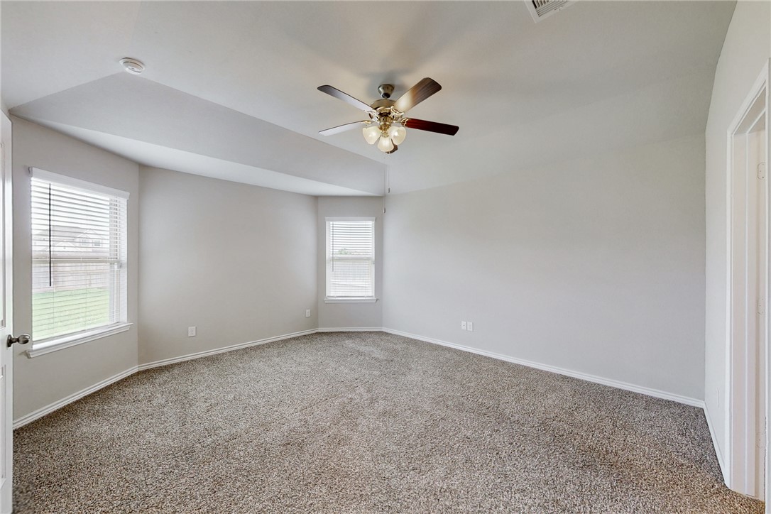 2010 Chief Street Bryan, TX 77807 - Photo 21 of 29 an empty room with windows and fan