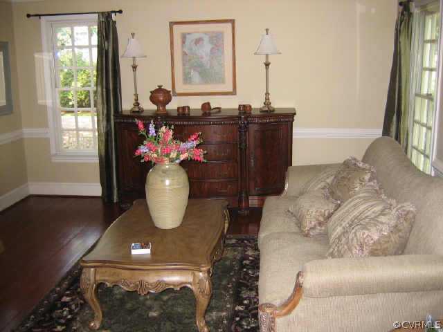 10706 Green Mt Road Richmond, VA 23238 - Photo 4 of 9 a living room with furniture and a potted plant