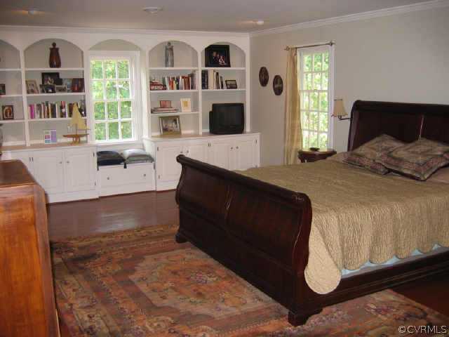 10706 Green Mt Road Richmond, VA 23238 - Photo 6 of 9 a bedroom with a bed and a window
