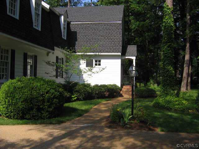 10706 Green Mt Road Richmond, VA 23238 - Photo 7 of 9 a view of a house with a yard