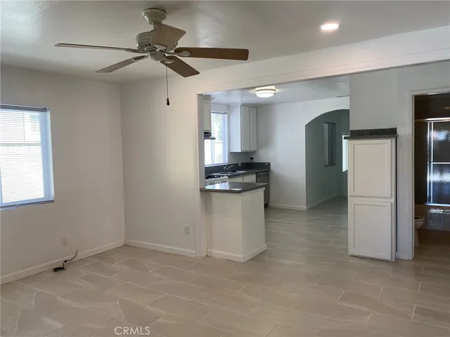 a kitchen with stainless steel appliances kitchen island a refrigerator sink and stove