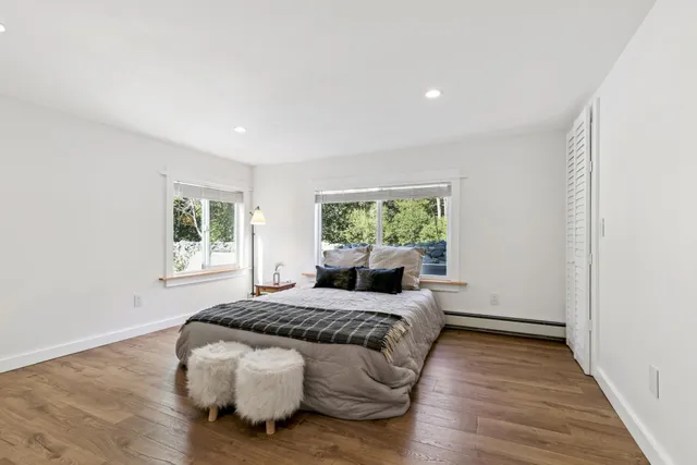 a bed room with a bed and a window