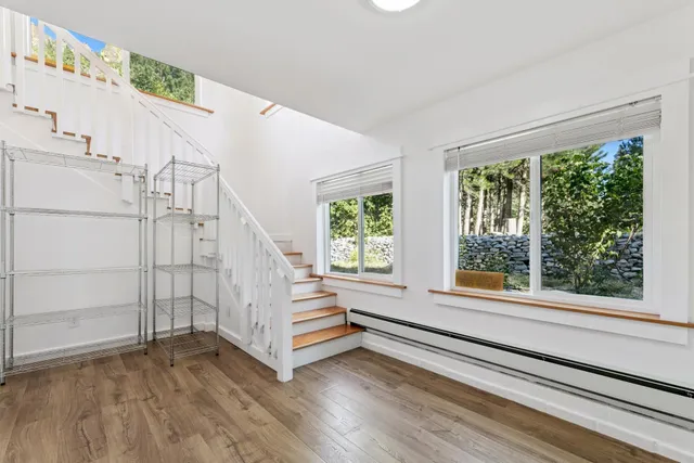 a view of entryway with stairs and wooden floor