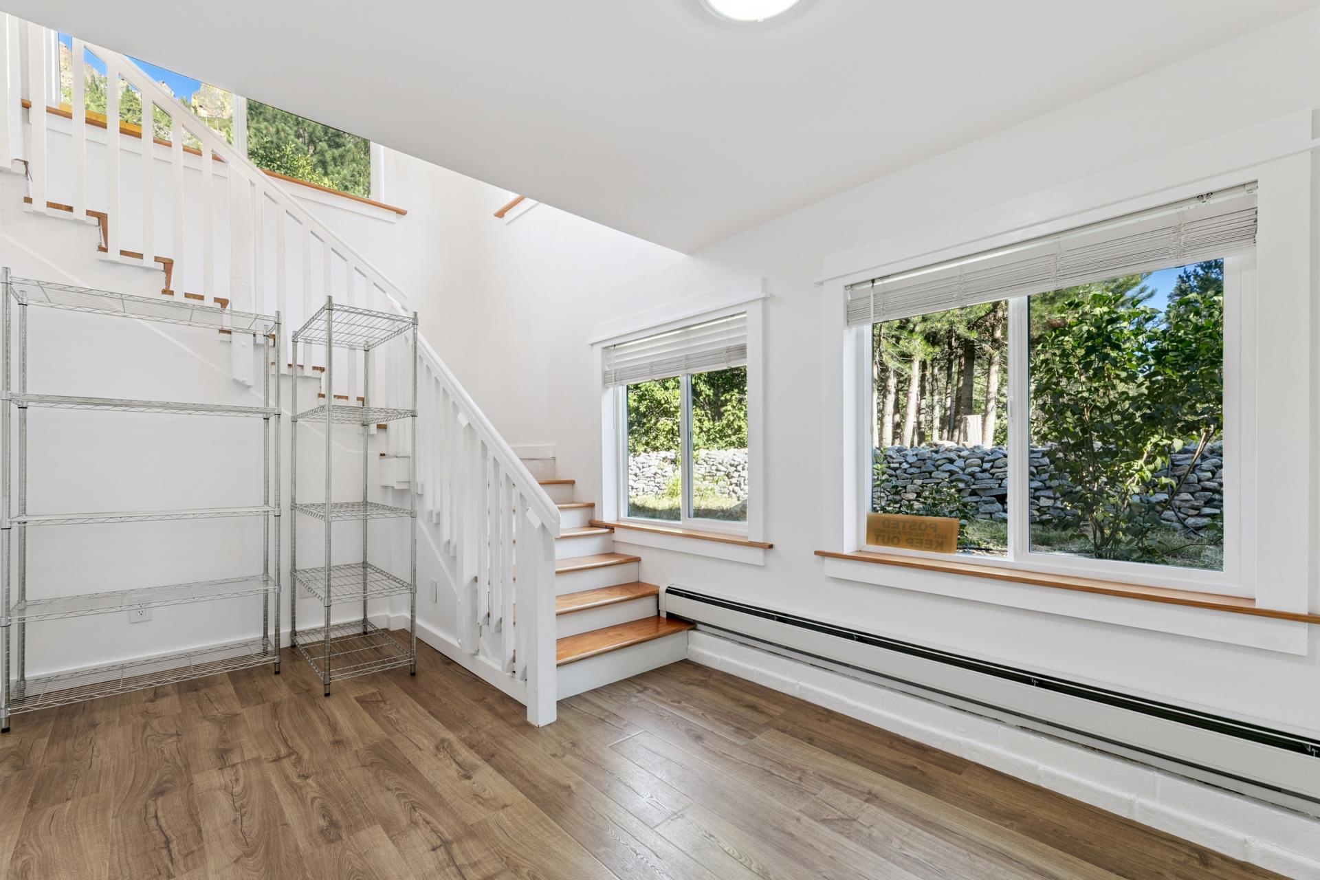 7594-7598 River Road Truckee, CA 96161 - Photo 12 of 27 a view of entryway with stairs and wooden floor