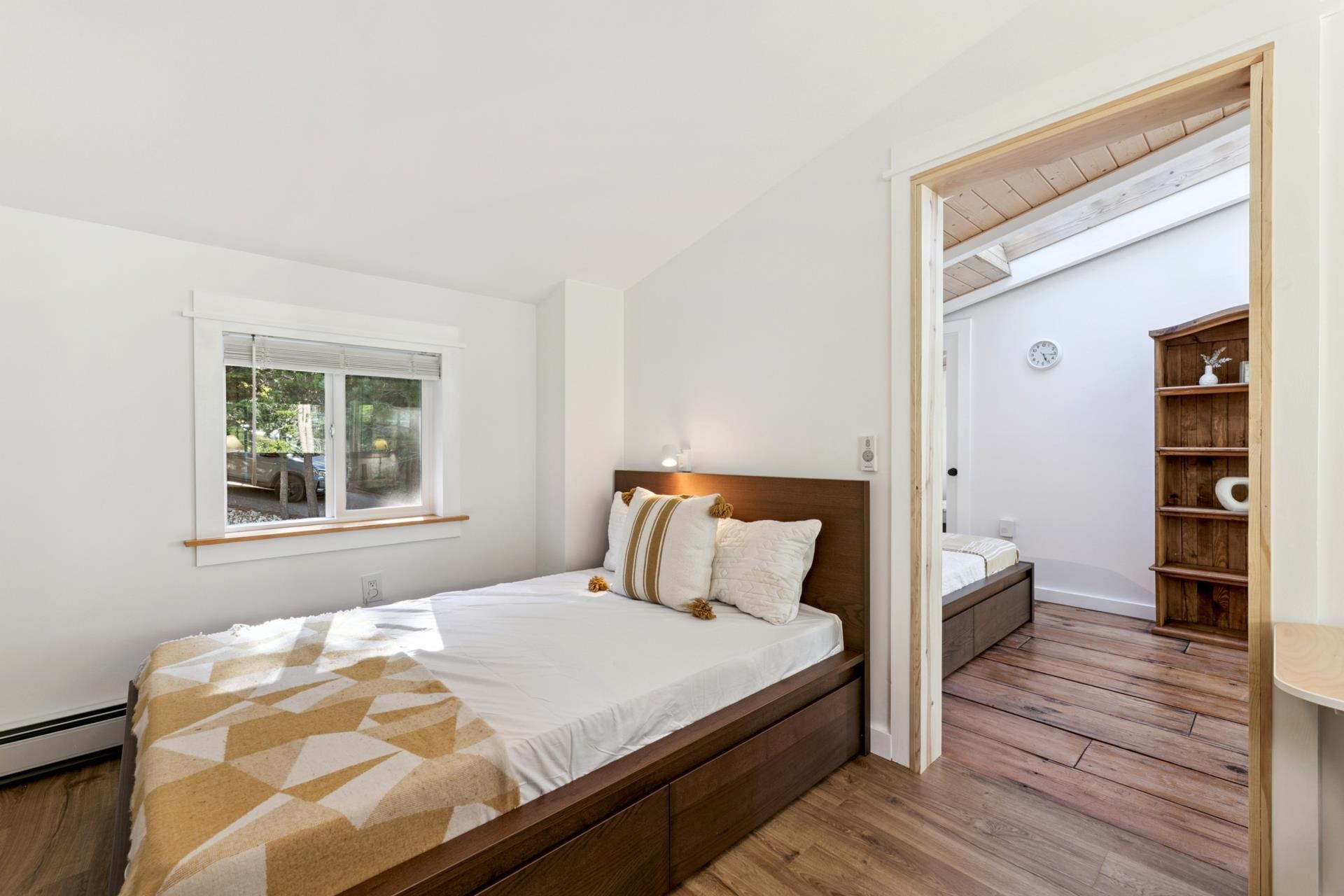 7594-7598 River Road Truckee, CA 96161 - Photo 19 of 27 a bedroom with a bed and a window