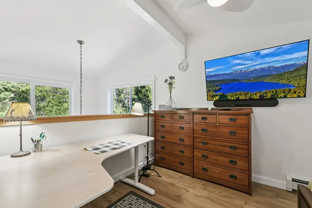 a bathroom with a sink vanity and a mirror