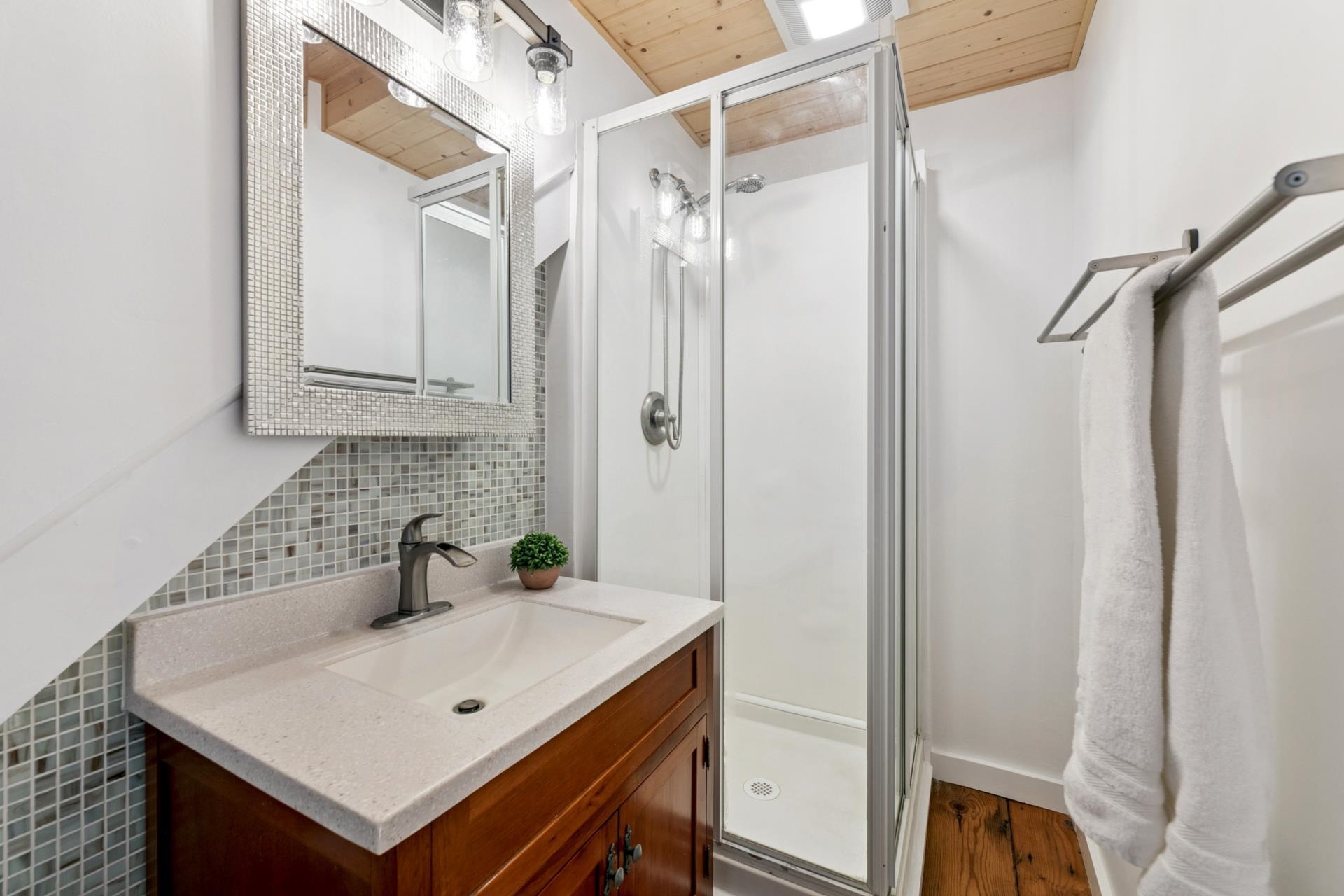 7594-7598 River Road Truckee, CA 96161 - Photo 21 of 27 a bathroom with a sink vanity and a mirror