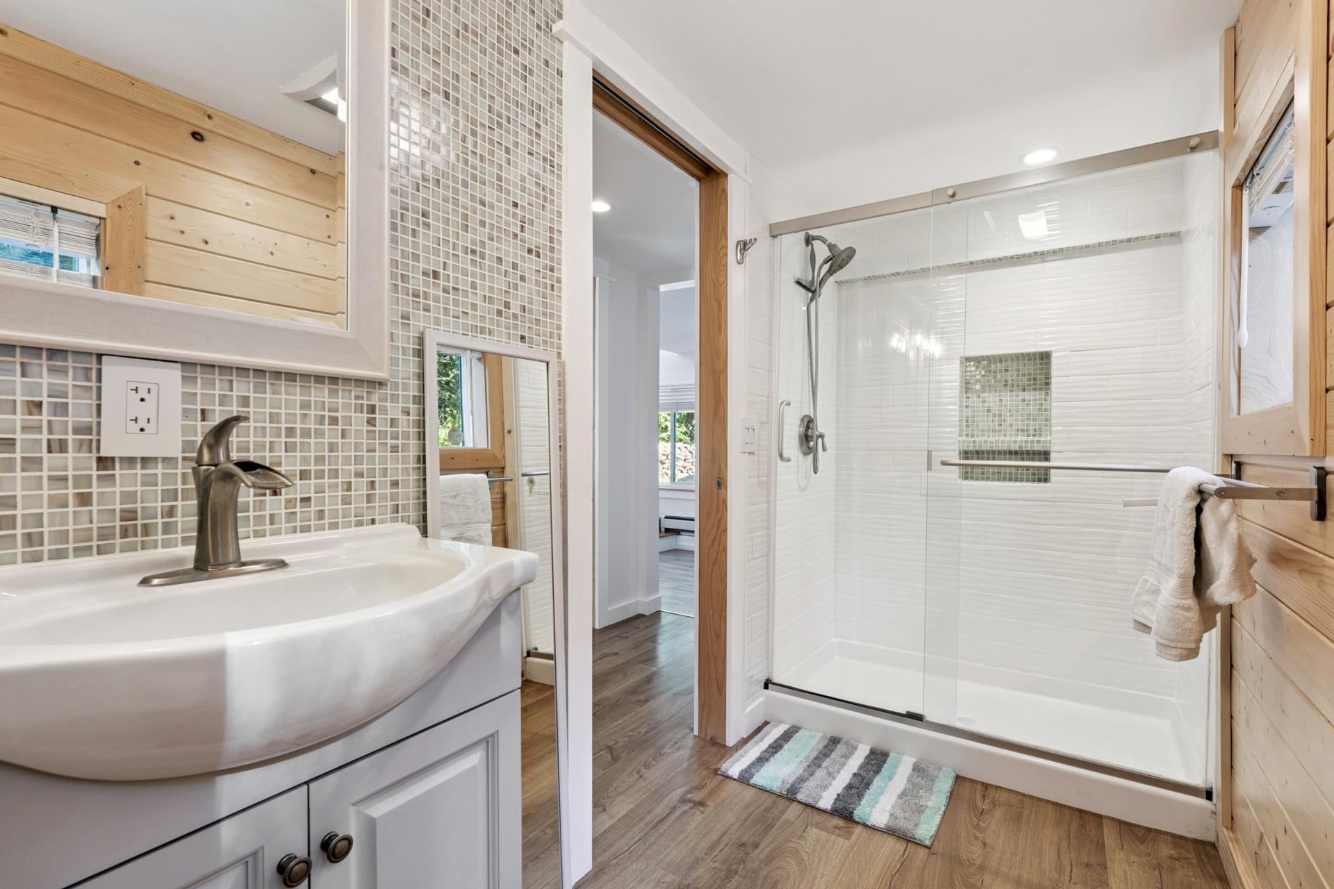 7594-7598 River Road Truckee, CA 96161 - Photo 23 of 27 a bathroom with a sink and a shower