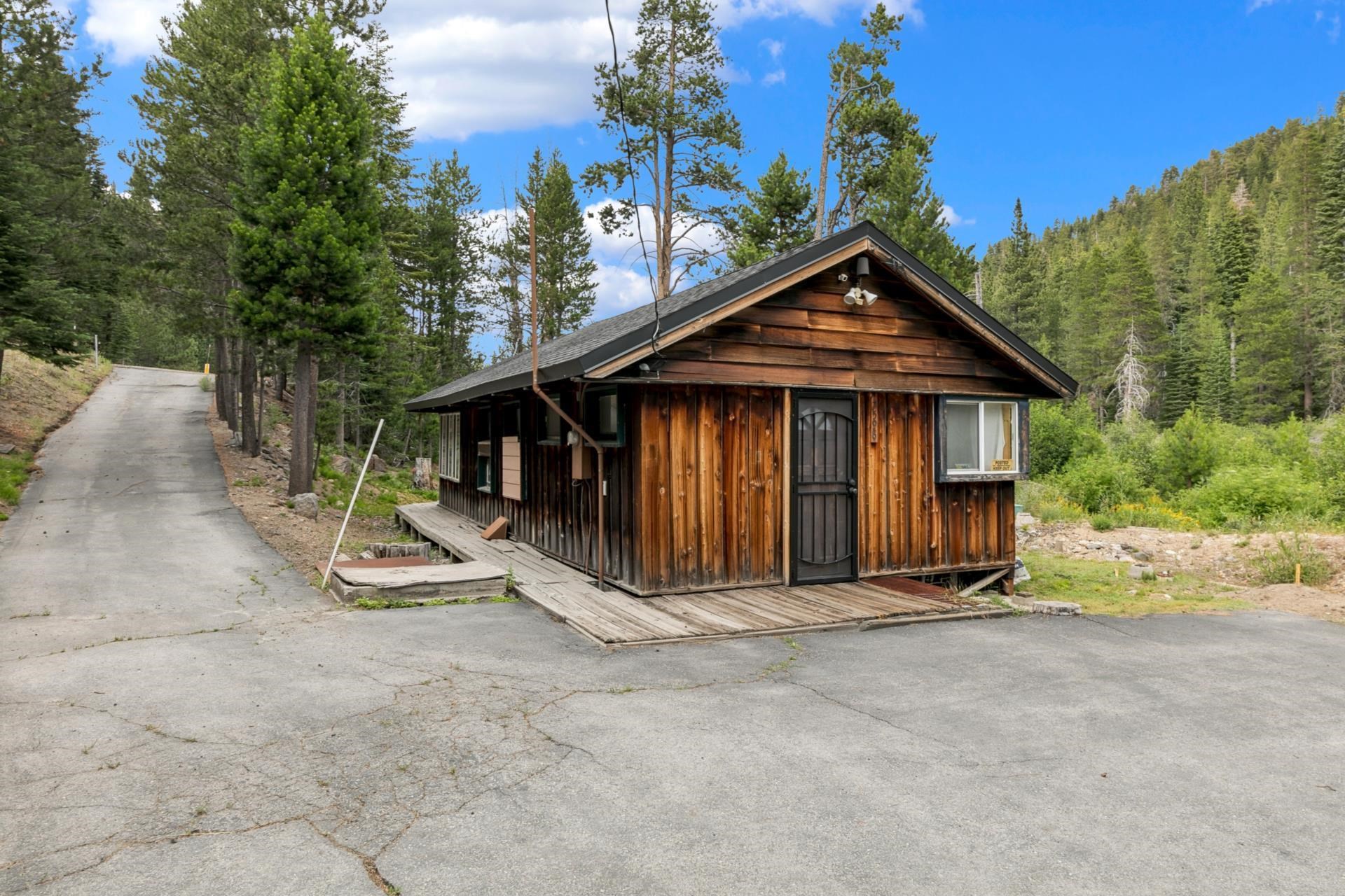 7594-7598 River Road Truckee, CA 96161 - Photo 24 of 27 a view of a house with backyard and trees