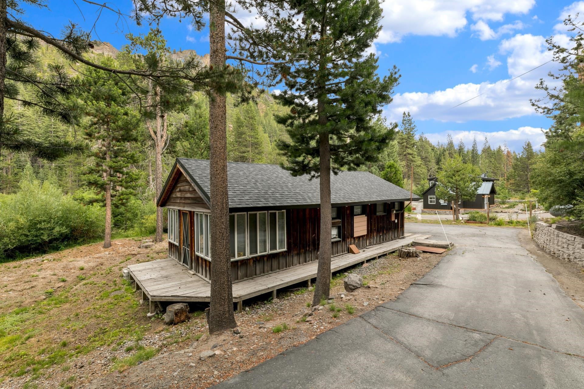 7594-7598 River Road Truckee, CA 96161 - Photo 25 of 27 a view of a house with backyard and sitting area
