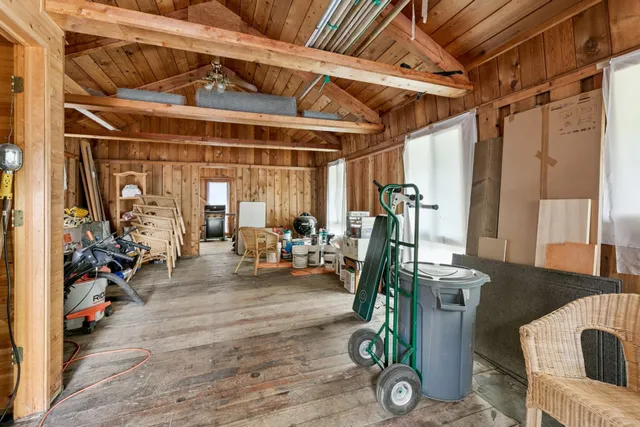 an aerial view of a house with a yard and garden