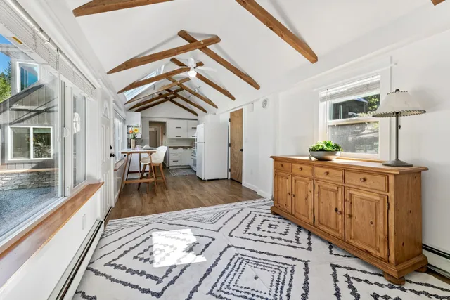 a bedroom with furniture and a chandelier
