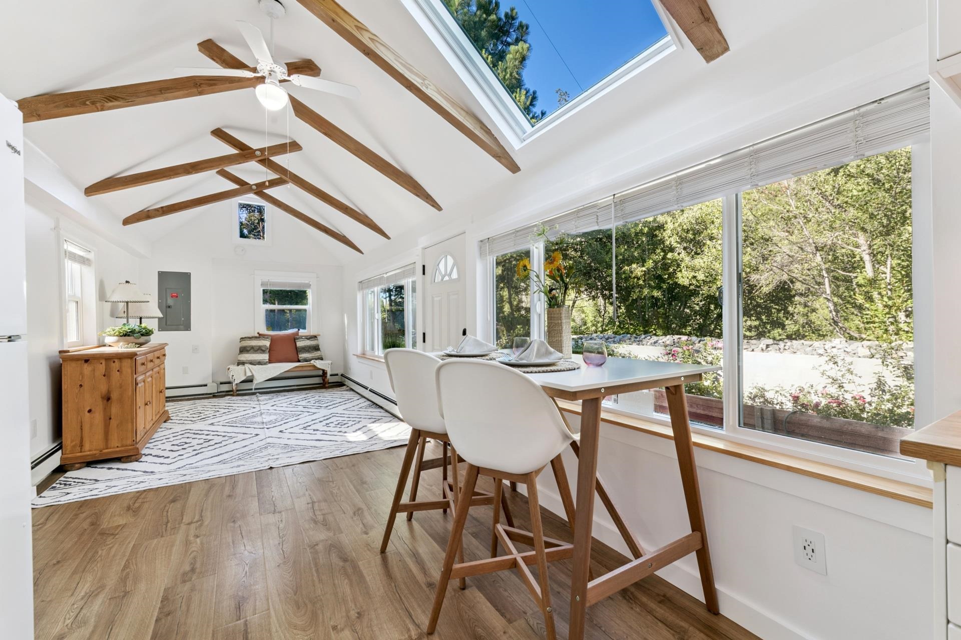 7594-7598 River Road Truckee, CA 96161 - Photo 8 of 27 a view of a dining room with furniture window and wooden floor