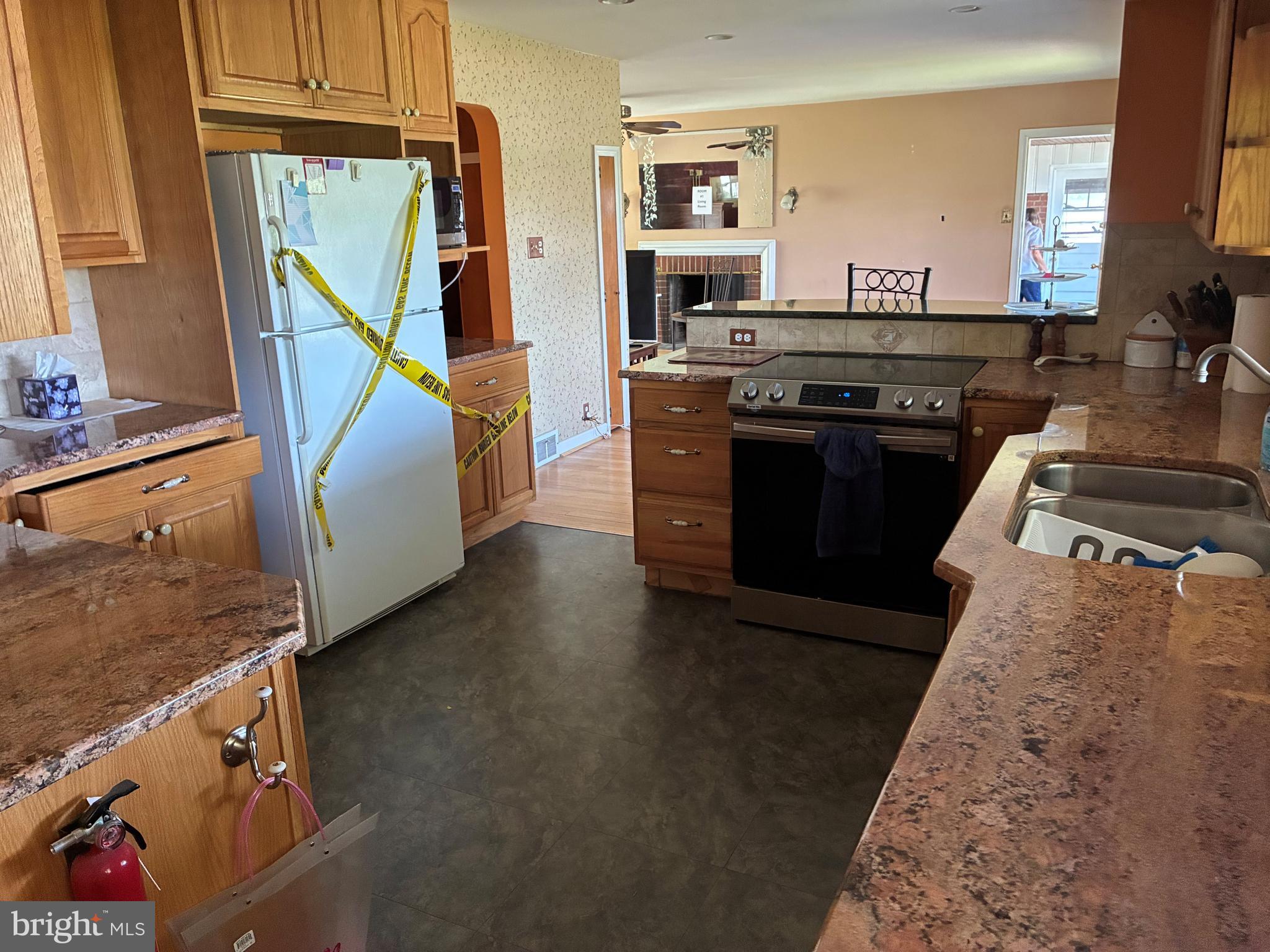 3 Yale Road Wilmington, DE 19805 - Photo 4 of 6 a kitchen with stainless steel appliances granite countertop a stove a sink and a refrigerator