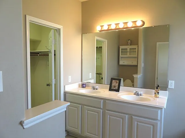 a bathroom with a toilet and a window