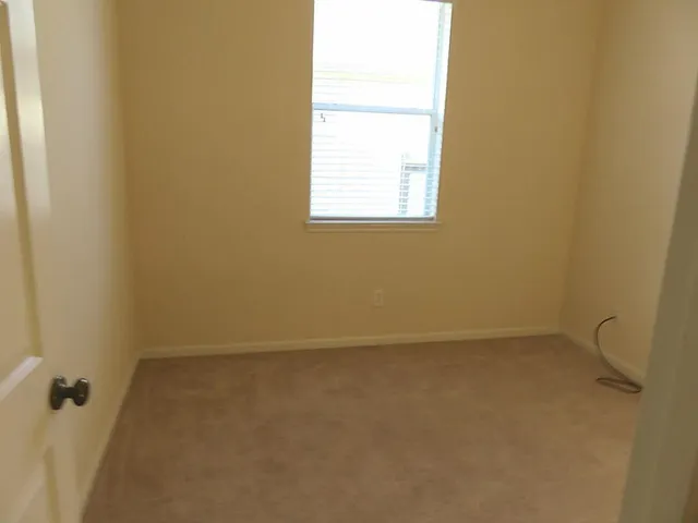 a view of a house with a garden and yard