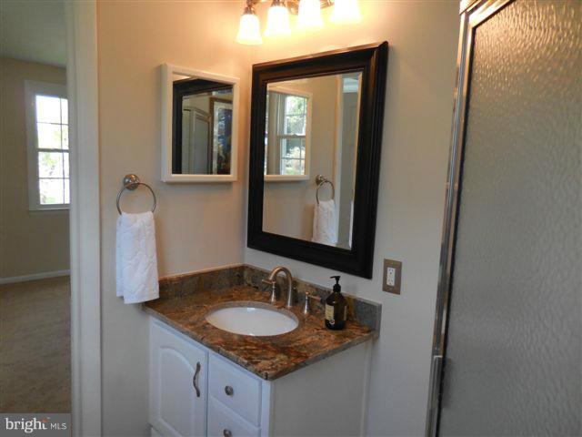 517 Shipley Road Linthicum, MD 21090 - Photo 14 of 30 a bathroom with vanity granite and a sink