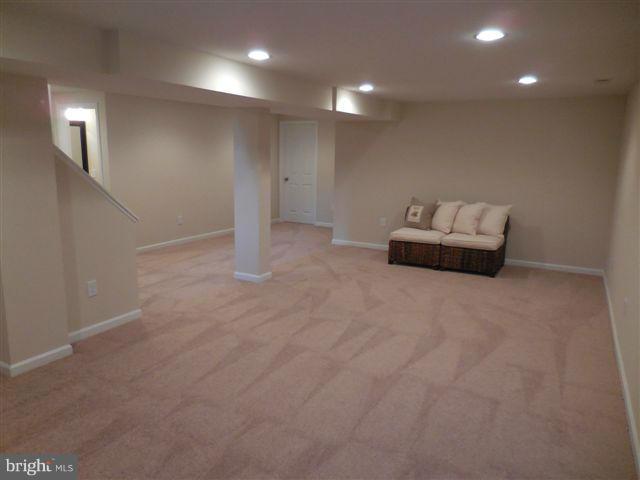 517 Shipley Road Linthicum, MD 21090 - Photo 21 of 30 an empty room with stairs and wooden floor