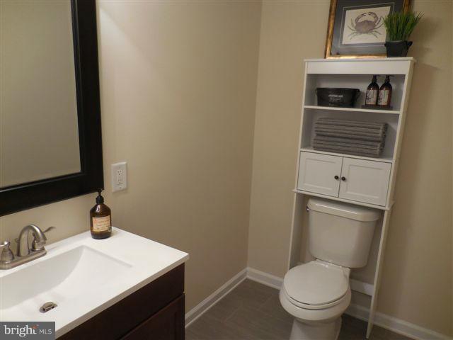517 Shipley Road Linthicum, MD 21090 - Photo 22 of 30 a bathroom with a sink toilet and vanity