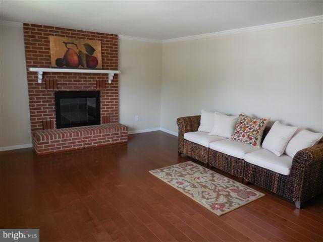 517 Shipley Road Linthicum, MD 21090 - Photo 5 of 30 a living room with furniture and a fireplace
