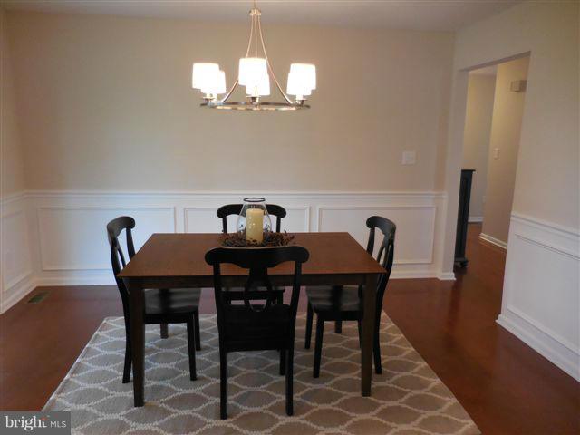 517 Shipley Road Linthicum, MD 21090 - Photo 7 of 30 a view of a dining room with furniture and wooden floor