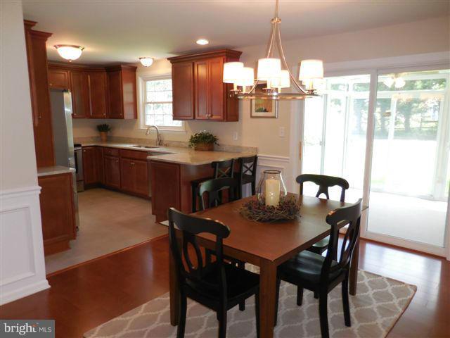 517 Shipley Road Linthicum, MD 21090 - Photo 8 of 30 a kitchen with a table and chairs in it