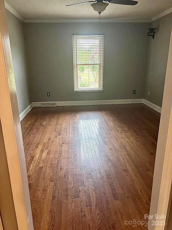 3129 Sims Road Rock Hill, SC 29730 - Photo 11 of 23 an empty room with wooden floor and windows