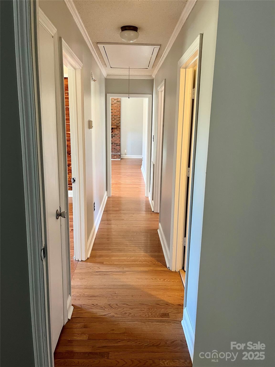 3129 Sims Road Rock Hill, SC 29730 - Photo 19 of 23 a view of a hallway with wooden floor and staircase