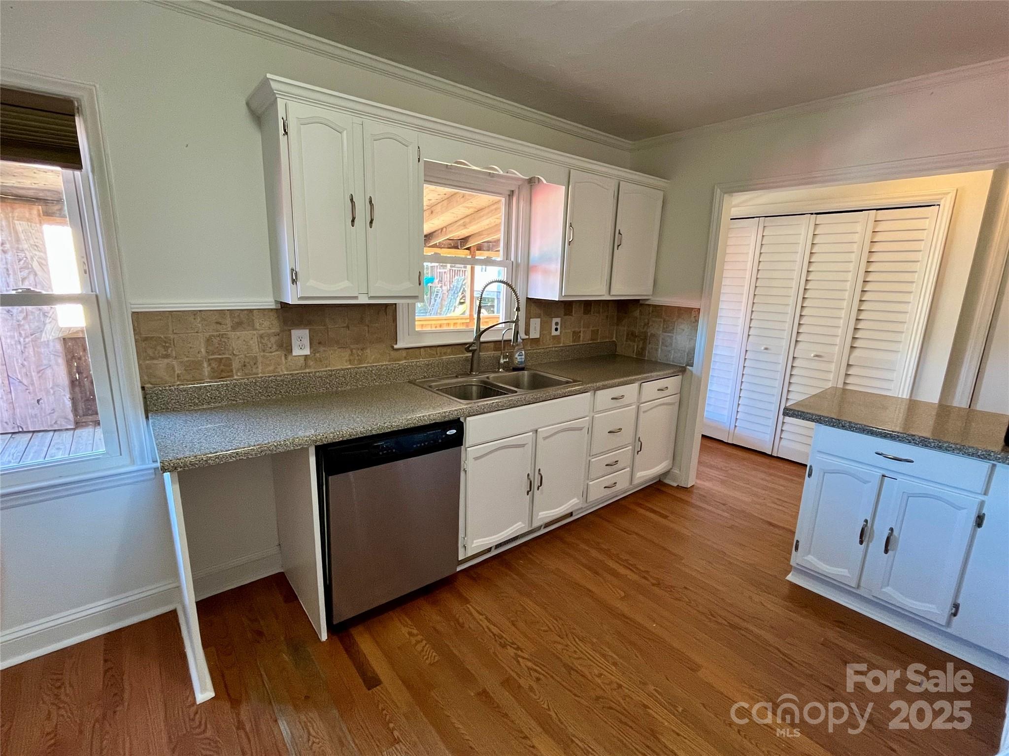 3129 Sims Road Rock Hill, SC 29730 - Photo 6 of 23 a kitchen with granite countertop wooden floors and white appliances