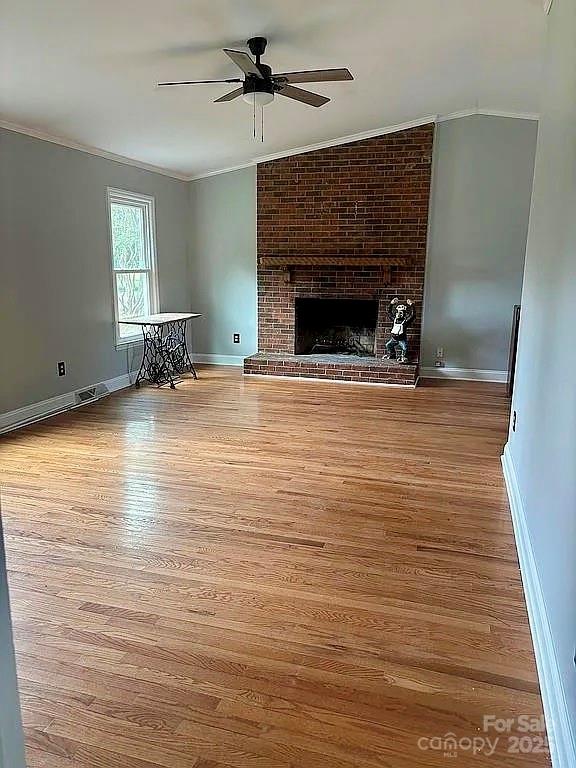 3129 Sims Road Rock Hill, SC 29730 - Photo 8 of 23 a view of empty room with wooden floor and fireplace