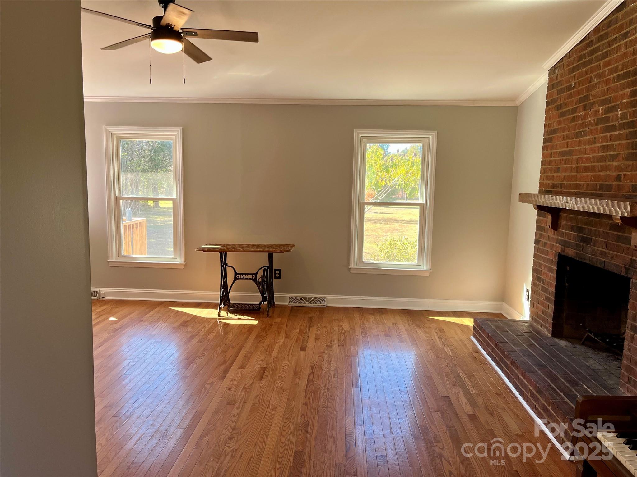 3129 Sims Road Rock Hill, SC 29730 - Photo 10 of 23 a view of an empty room with wooden floor and a window