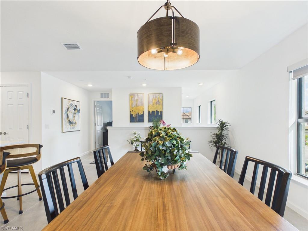 5683 Mayflower Way, Unit 908 Ave Maria, FL 34142 - Photo 6 of 37 Dining area with light tile patterned flooring and recessed lighting