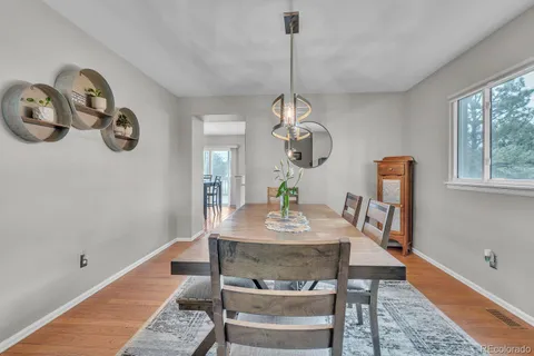 a view of a dining room and a window