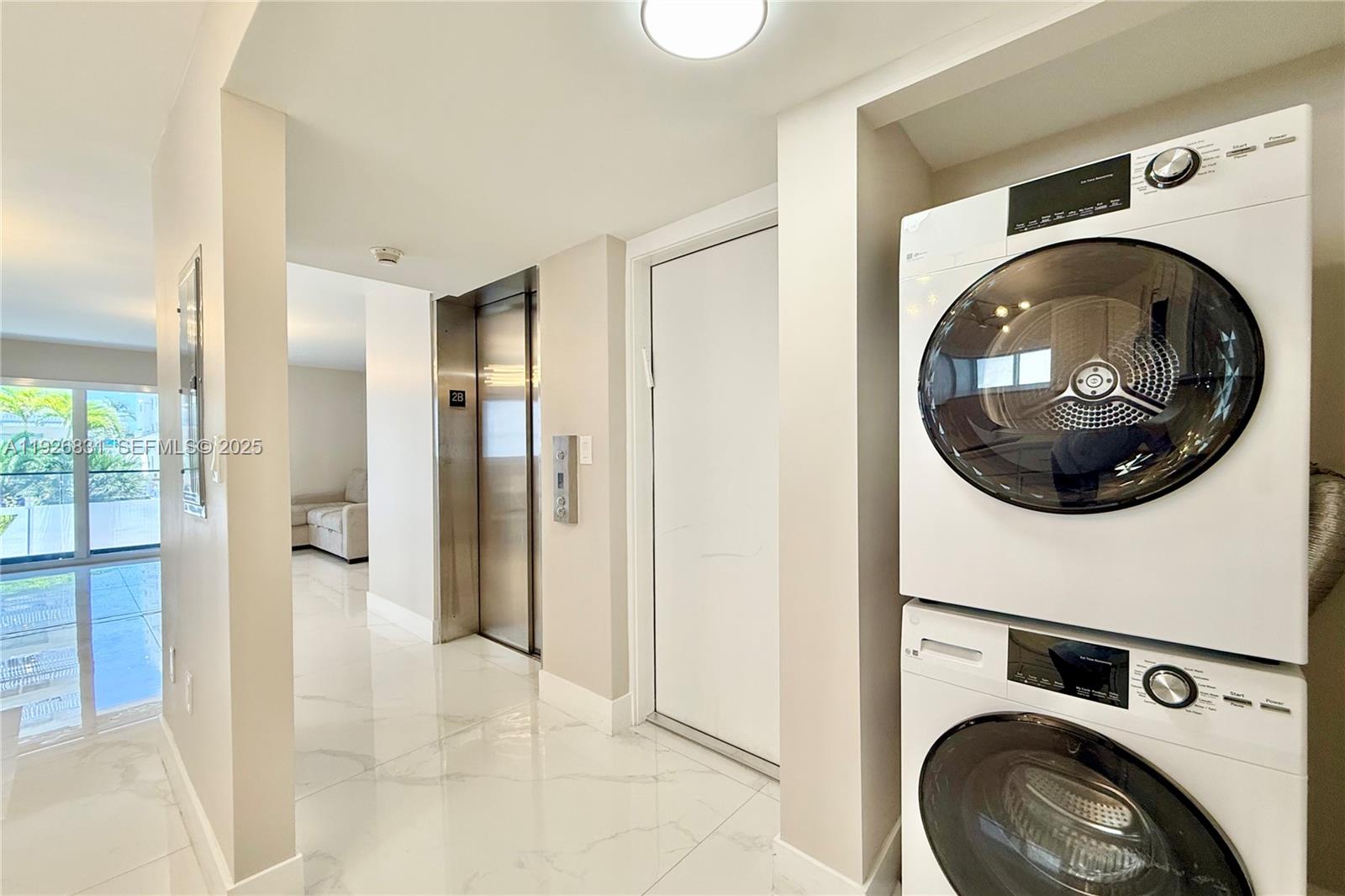 4122 Collins Avenue, Unit 2B Miami Beach, FL 33140 - Photo 11 of 13 a view of a hallway with washer and dryer