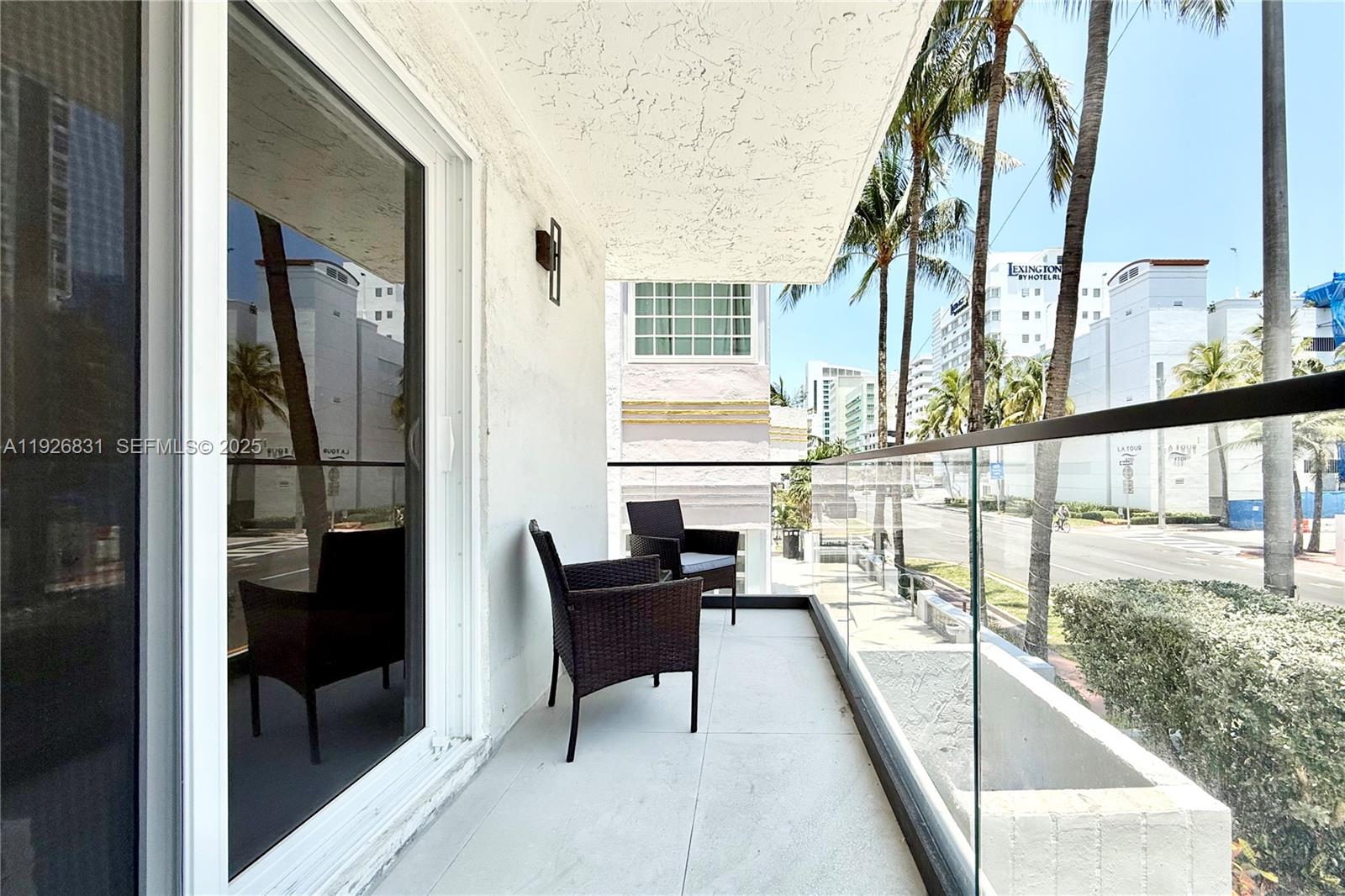 4122 Collins Avenue, Unit 2B Miami Beach, FL 33140 - Photo 12 of 13 a view of balcony with furniture