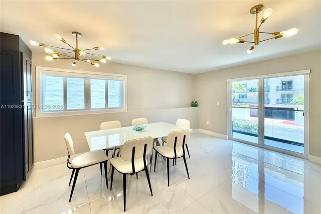 a bedroom with two beds and a chandelier