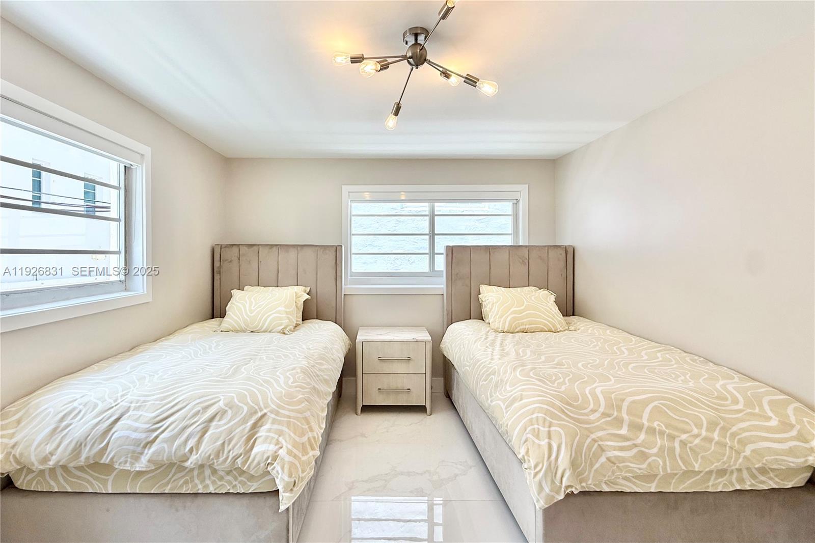 4122 Collins Avenue, Unit 2B Miami Beach, FL 33140 - Photo 6 of 13 a bedroom with a bed and window