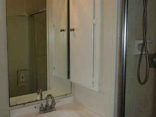 a bathroom with a sink and a mirror