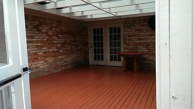 an empty room with wooden floor