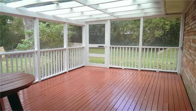 9122 Western Drive Houston, TX 77080 - Photo 18 of 20 a view of balcony with wooden floor