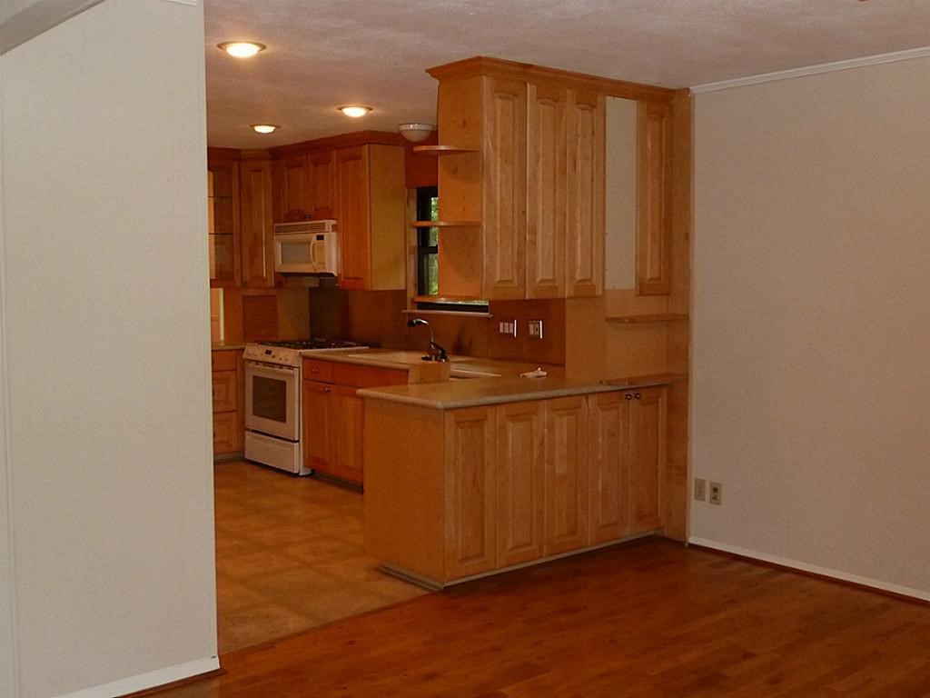 9122 Western Drive Houston, TX 77080 - Photo 7 of 20 a kitchen with stainless steel appliances granite countertop a sink a stove a microwave a sink and a refrigerator