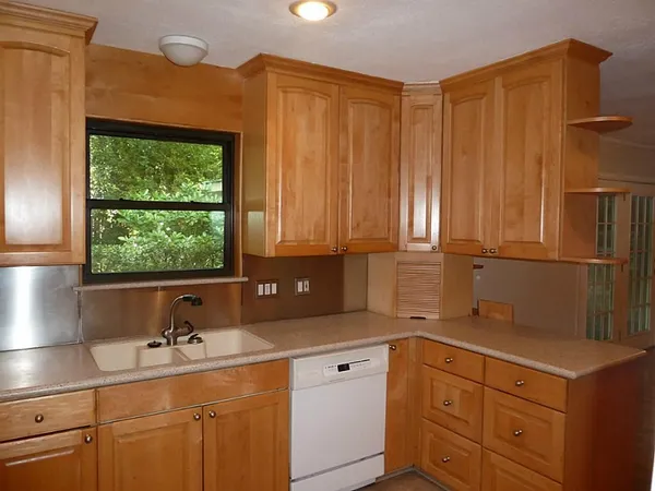 a kitchen with a sink and cabinets
