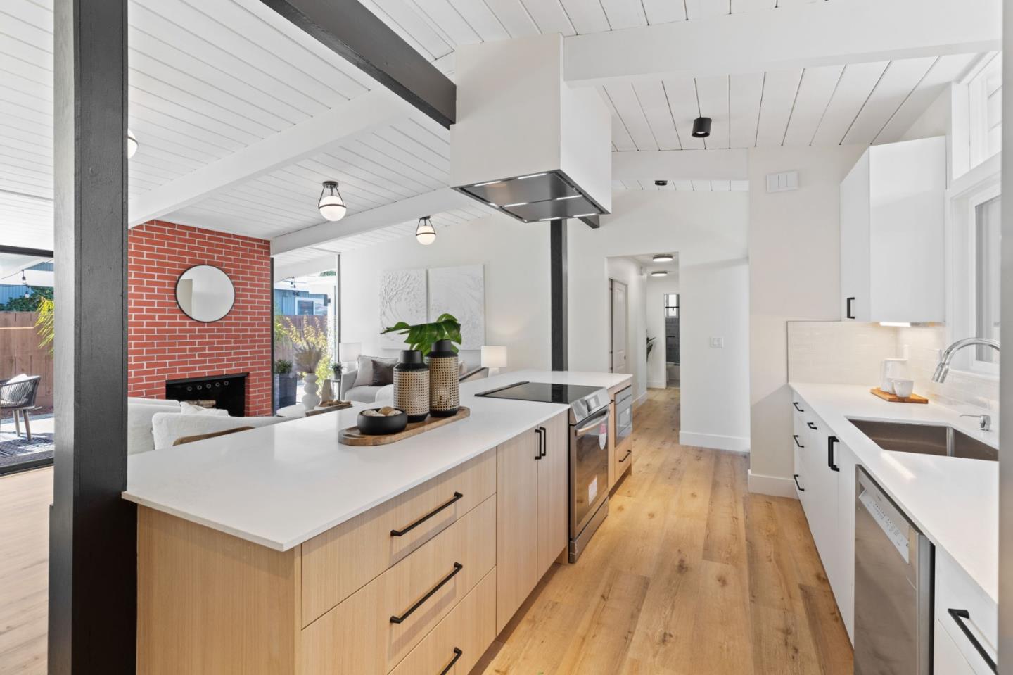 1734 Wolfe Drive San Mateo, CA 94402 - Photo 11 of 43 a kitchen with a sink stove and cabinets