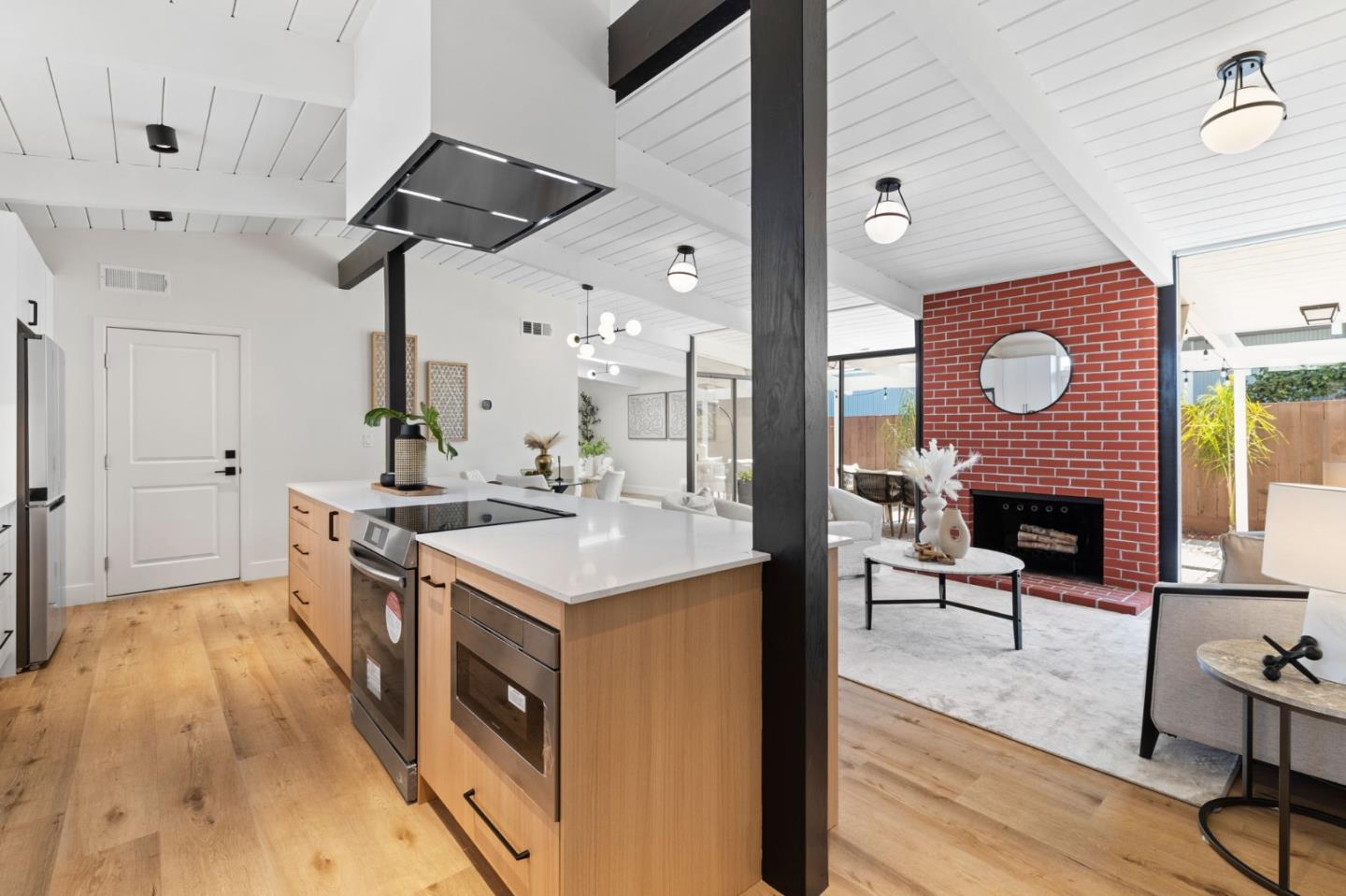 1734 Wolfe Drive San Mateo, CA 94402 - Photo 12 of 43 a kitchen with stainless steel appliances granite countertop a stove and a wooden floors