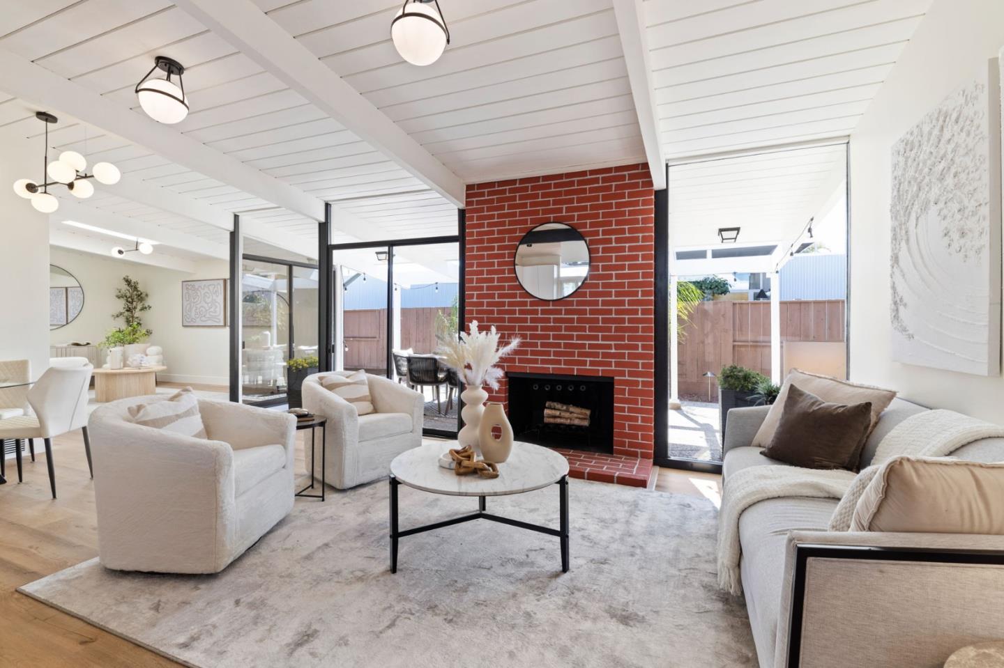 1734 Wolfe Drive San Mateo, CA 94402 - Photo 13 of 43 a living room with furniture a fireplace and a large window