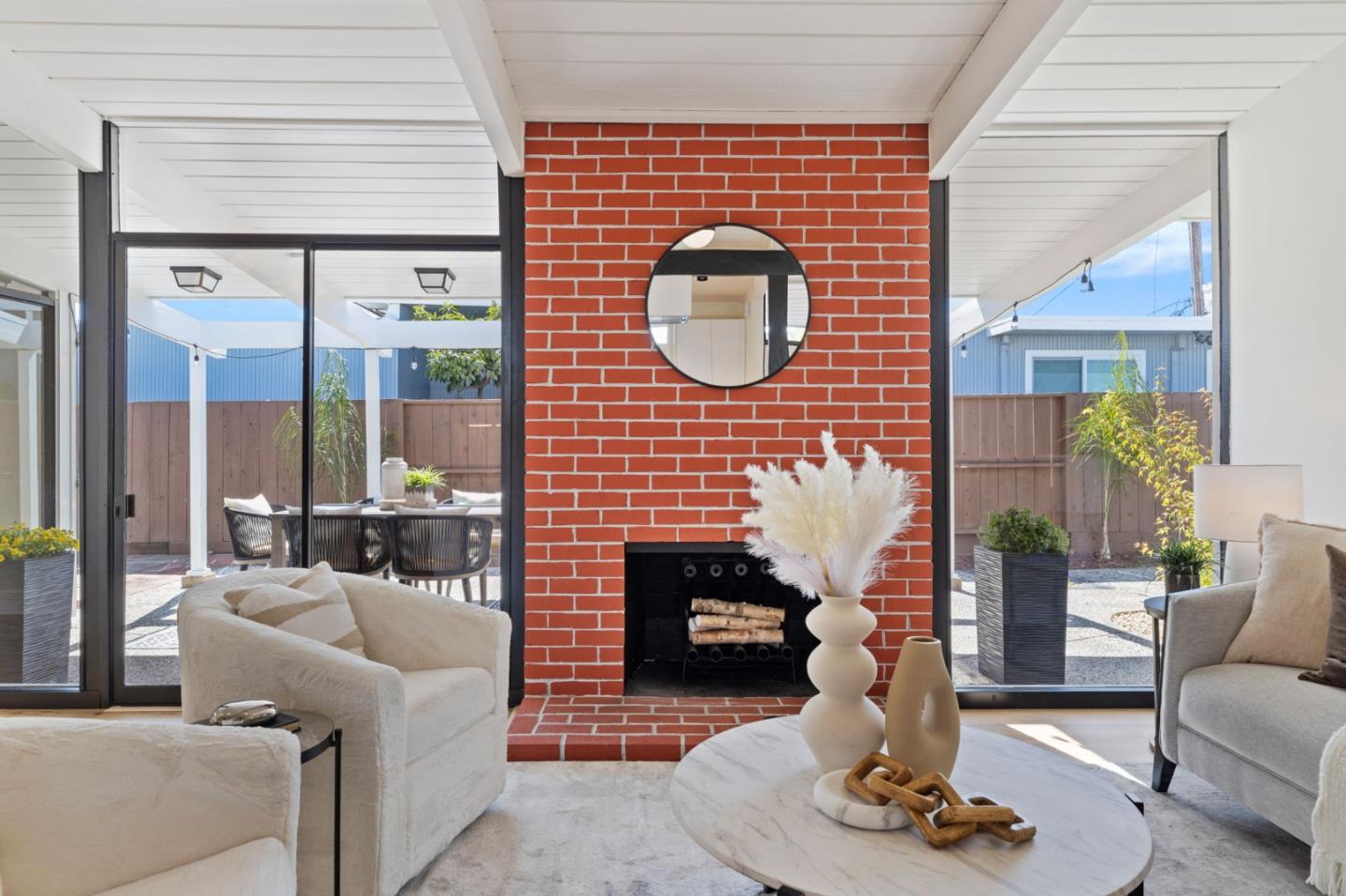 1734 Wolfe Drive San Mateo, CA 94402 - Photo 14 of 43 a living room with furniture and a large window