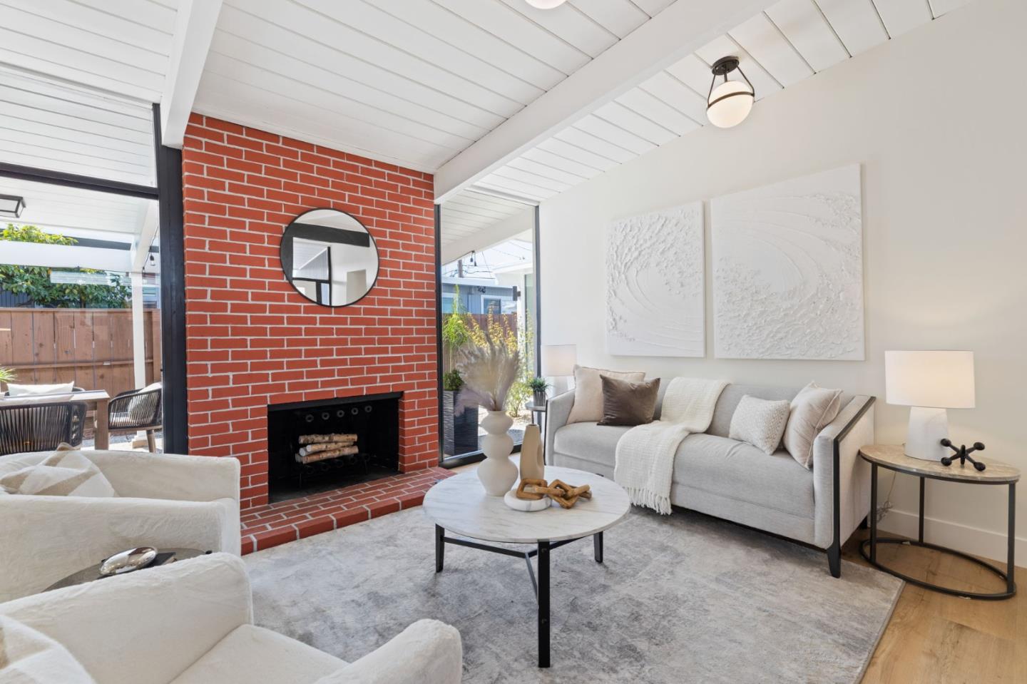 1734 Wolfe Drive San Mateo, CA 94402 - Photo 15 of 43 a living room with furniture and a fireplace