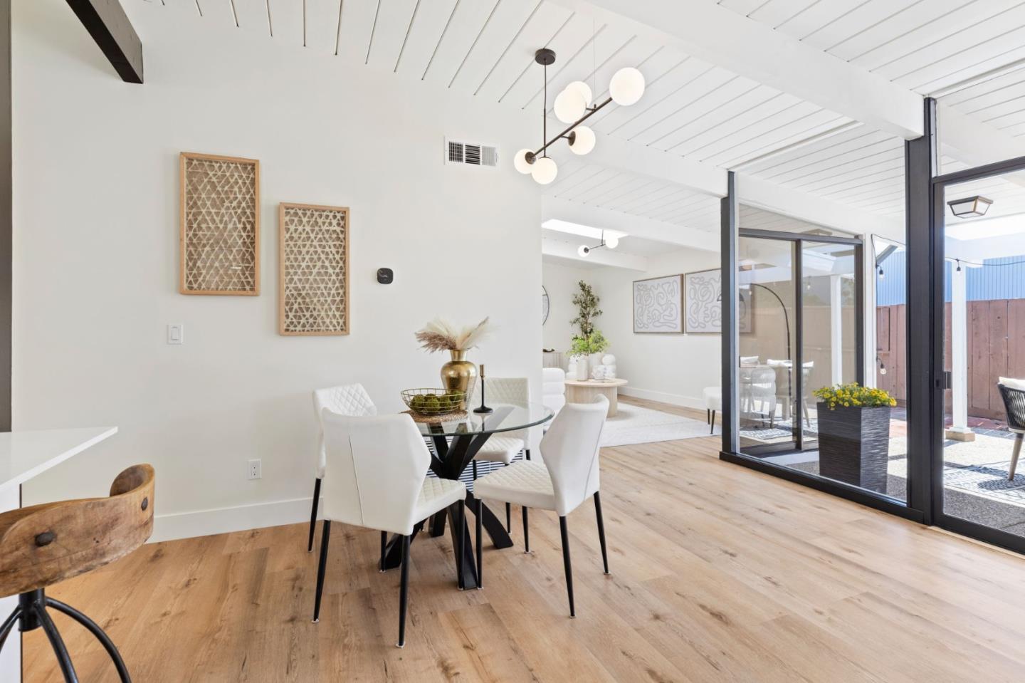 1734 Wolfe Drive San Mateo, CA 94402 - Photo 16 of 43 a view of a dining room with furniture and wooden floor